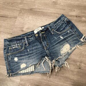 Abercrombie & Fitch Low-Rise Distressed Denim Cutoff Shorts with Striped Pocket